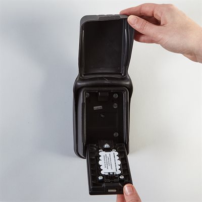 Wall-mounted locking storage box for keys and access cards with push-button lock and weather cover