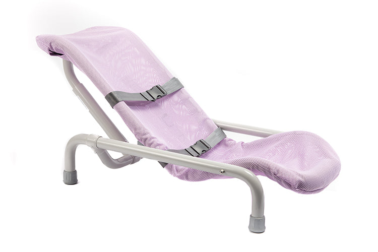 Child seated in Contour Deluxe PVC bath chair with head support