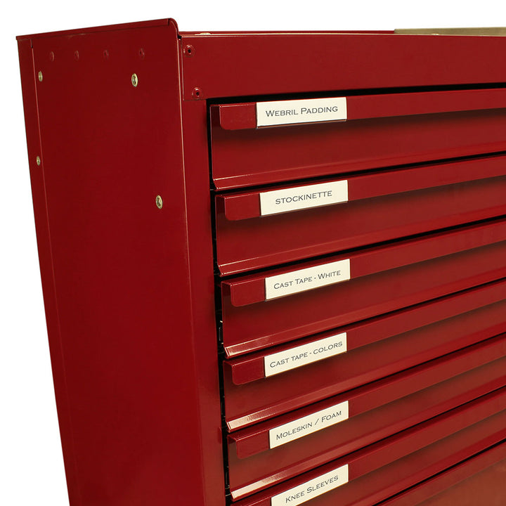 Clear plastic label holders attached to Harloff cast cart drawers for supply organization