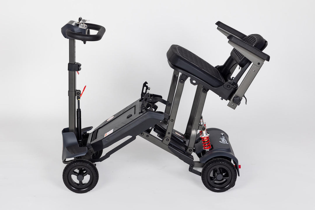 Genie Auto lightweight automatic folding scooter indoors