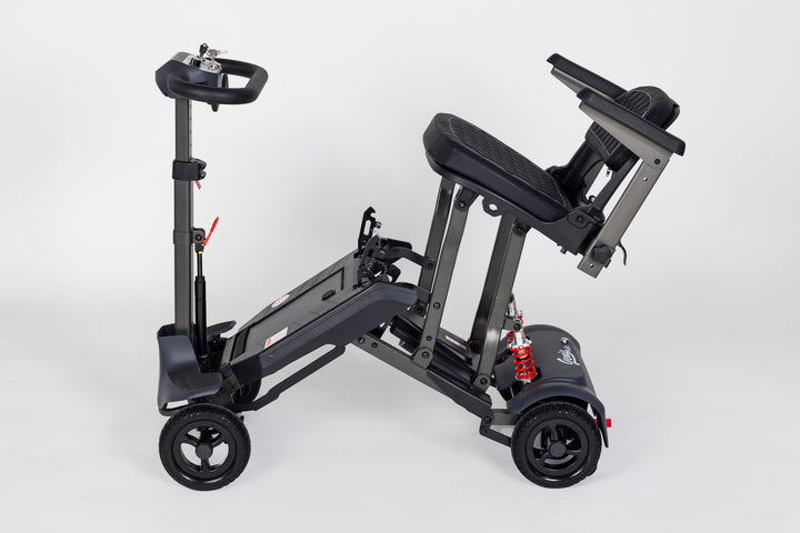 Genie Auto lightweight automatic folding scooter indoors