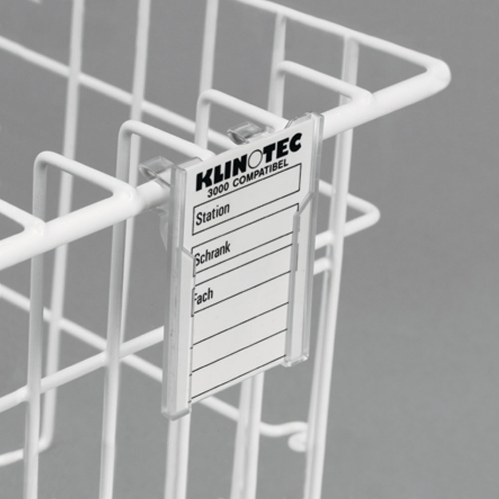 Plastic clip-on label holder attached to MedStor Max cabinet basket