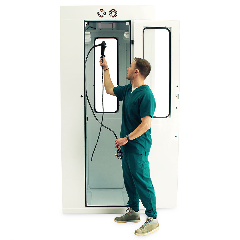 Nurse accessing pass-through scope cabinet from procedure room