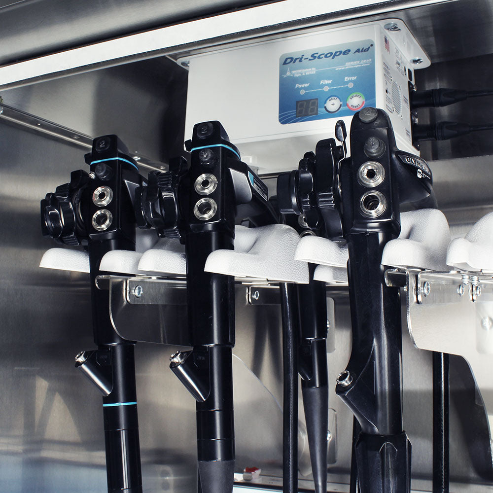 Closeup of stainless Dri-Scope Aid endoscope holder inside SureDry cabinet