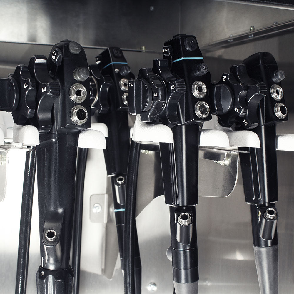Close-up of stainless endoscope mounting system inside cabinet