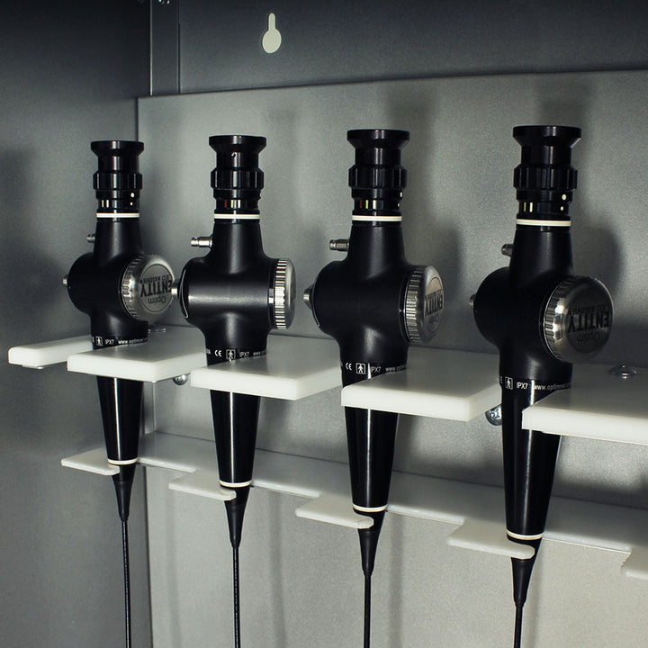 Close-up of scope holders inside ENT drying cabinet