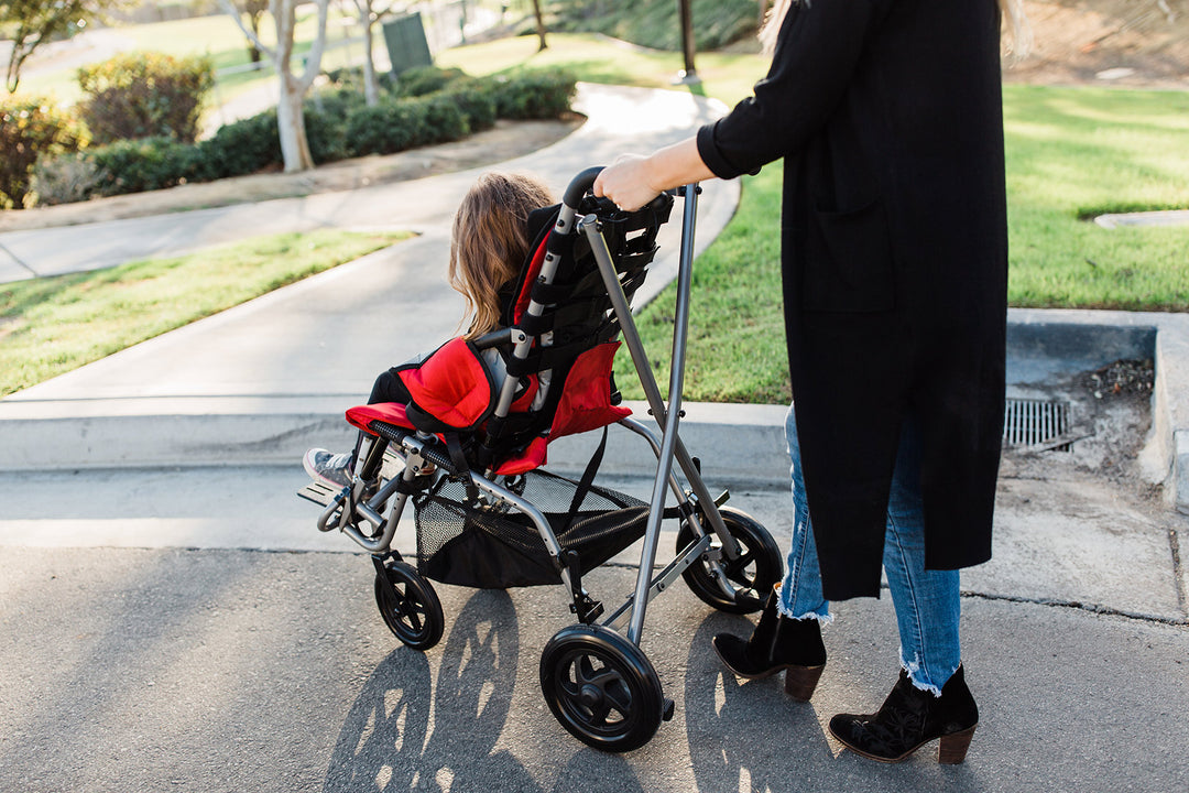 Trotter pediatric chair side view with transit-ready frame